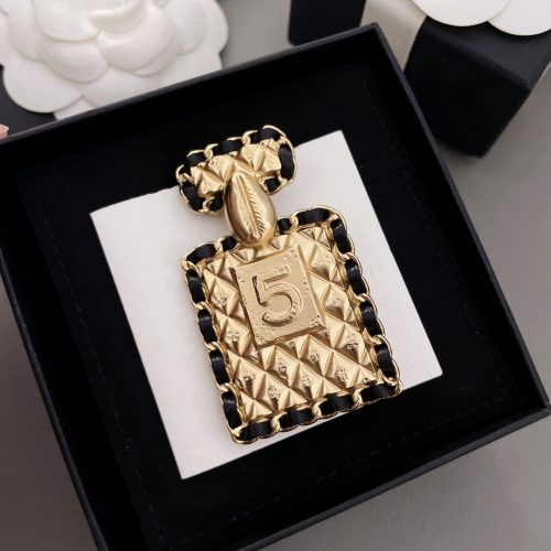 Ch brooch